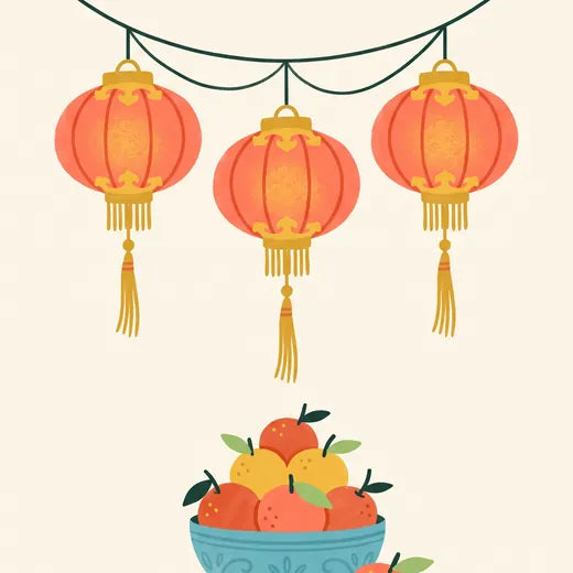 Red lanterns and a bowl of oranges