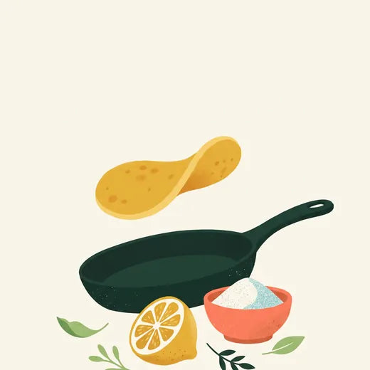 A pan with a pancake and lemon